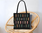 Black tote bag with disk golf pattern and name text