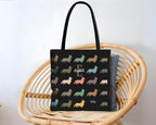 Black tote bag with dog pattern and initial name text