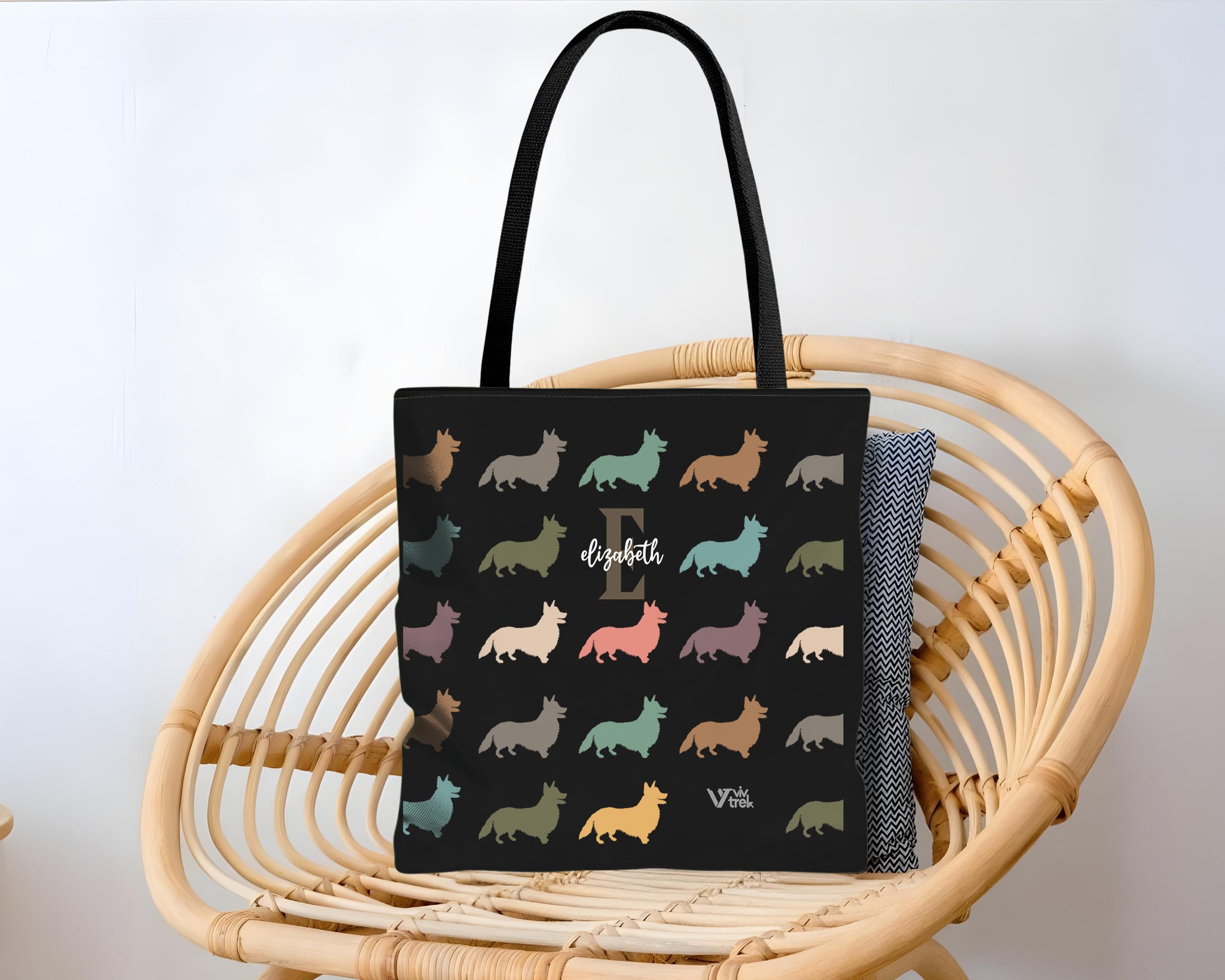 Black tote bag with dog pattern and initial name text