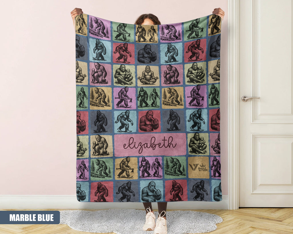 Person holding a colorful bigfoot blanket with name printed on it