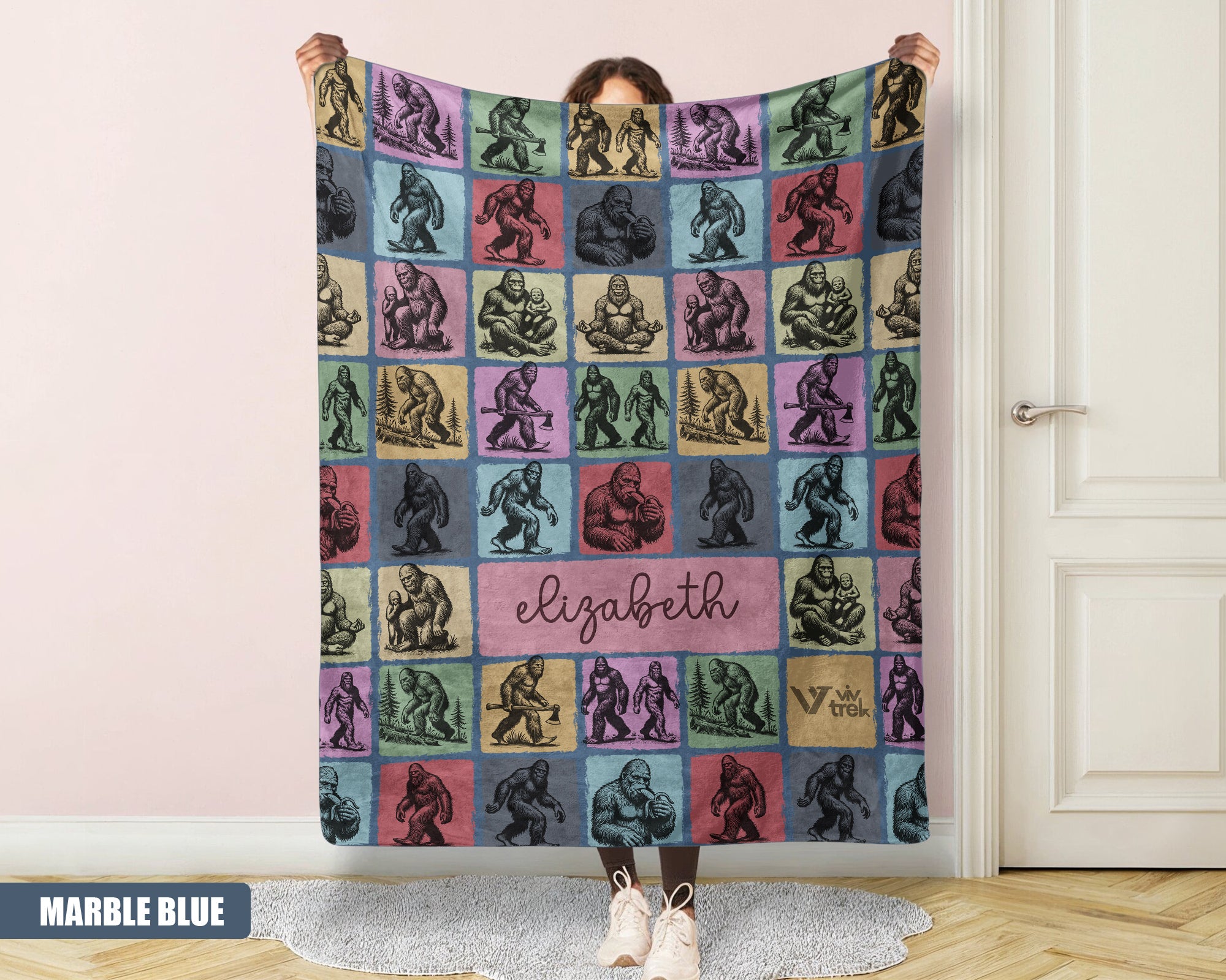 Person holding a colorful bigfoot blanket with name printed on it