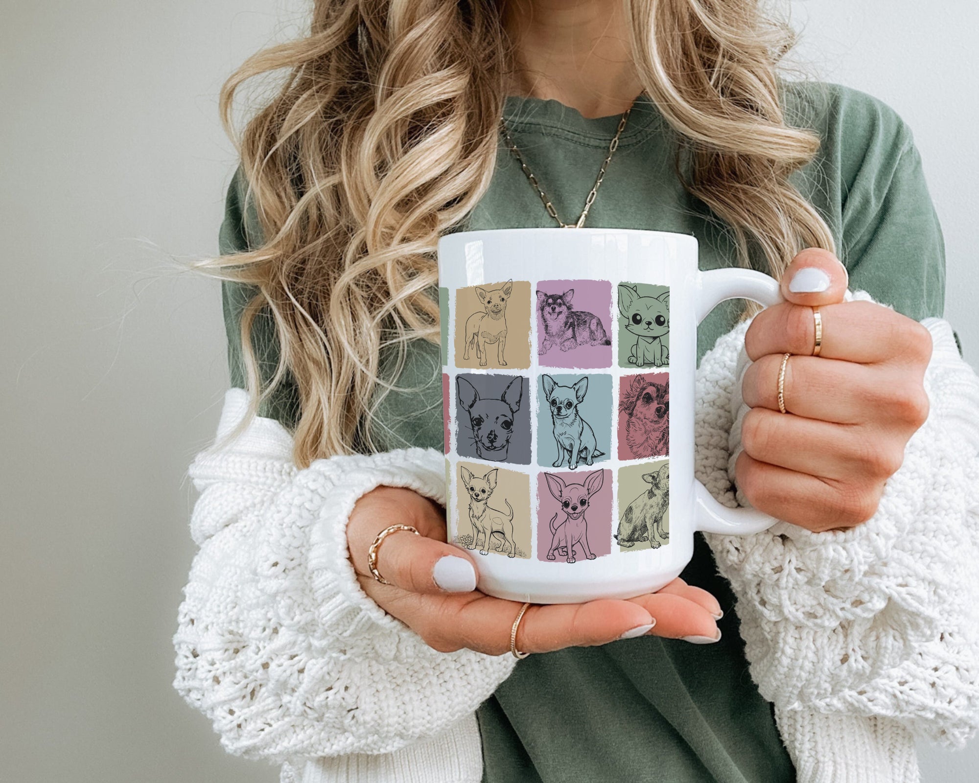 Person holding a mug with cat pattern design