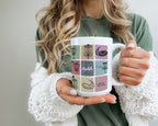 Person holding a mug with decorative patterns and text