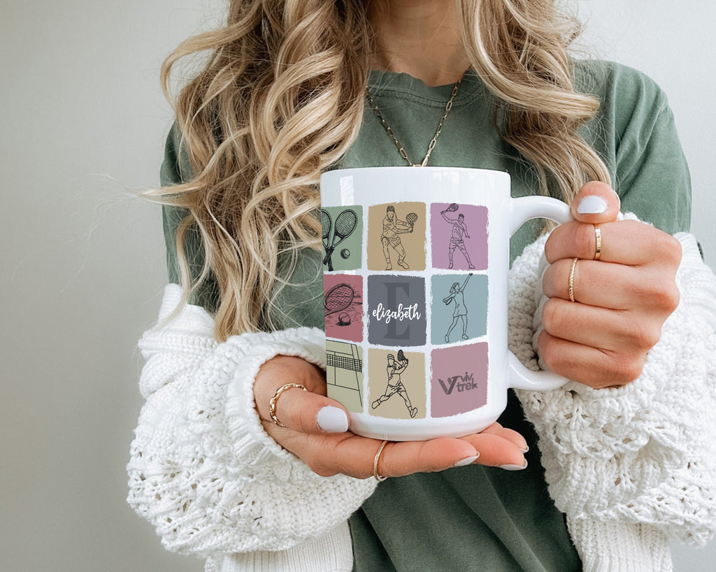 Person holding a mug with graphic design and text