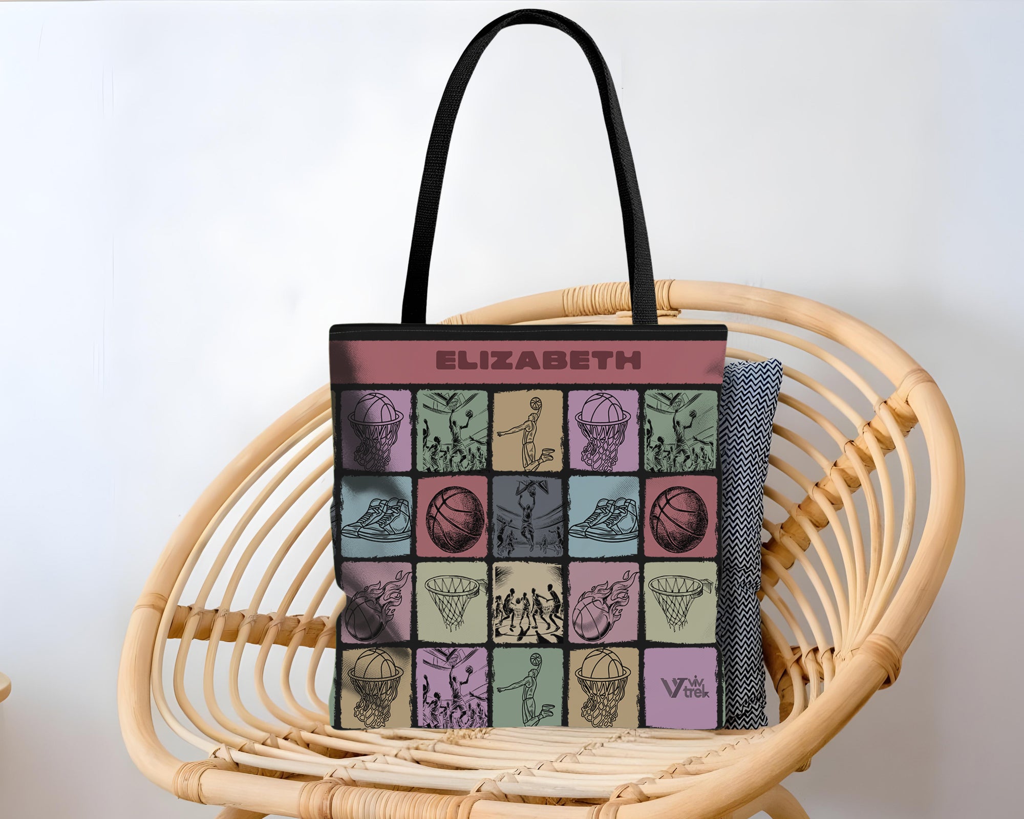 Tote bag with artistic basketball designs and Name branding text.