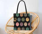 Tote bag with colorful basketball pattern design.