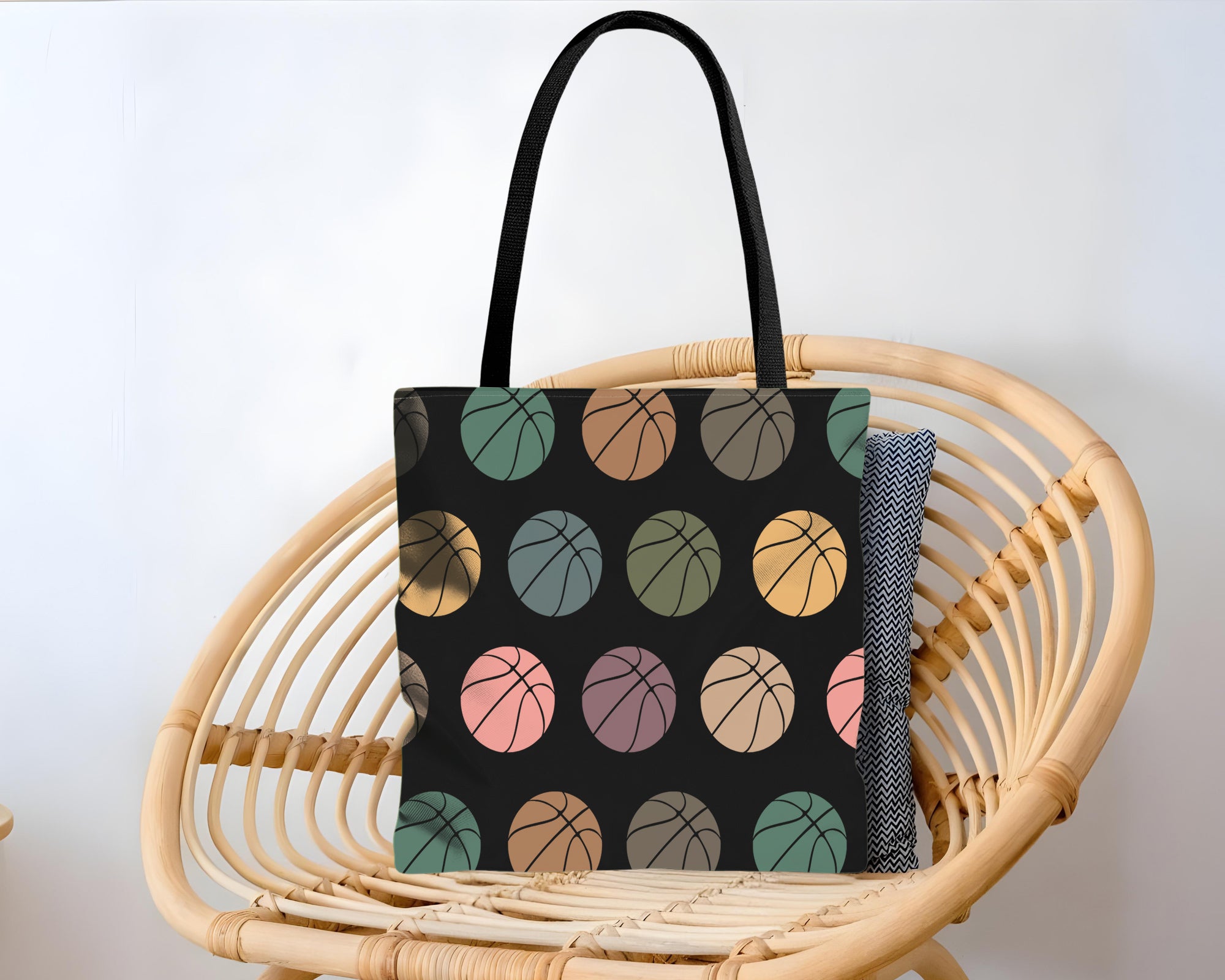 Tote bag with colorful basketball pattern design.