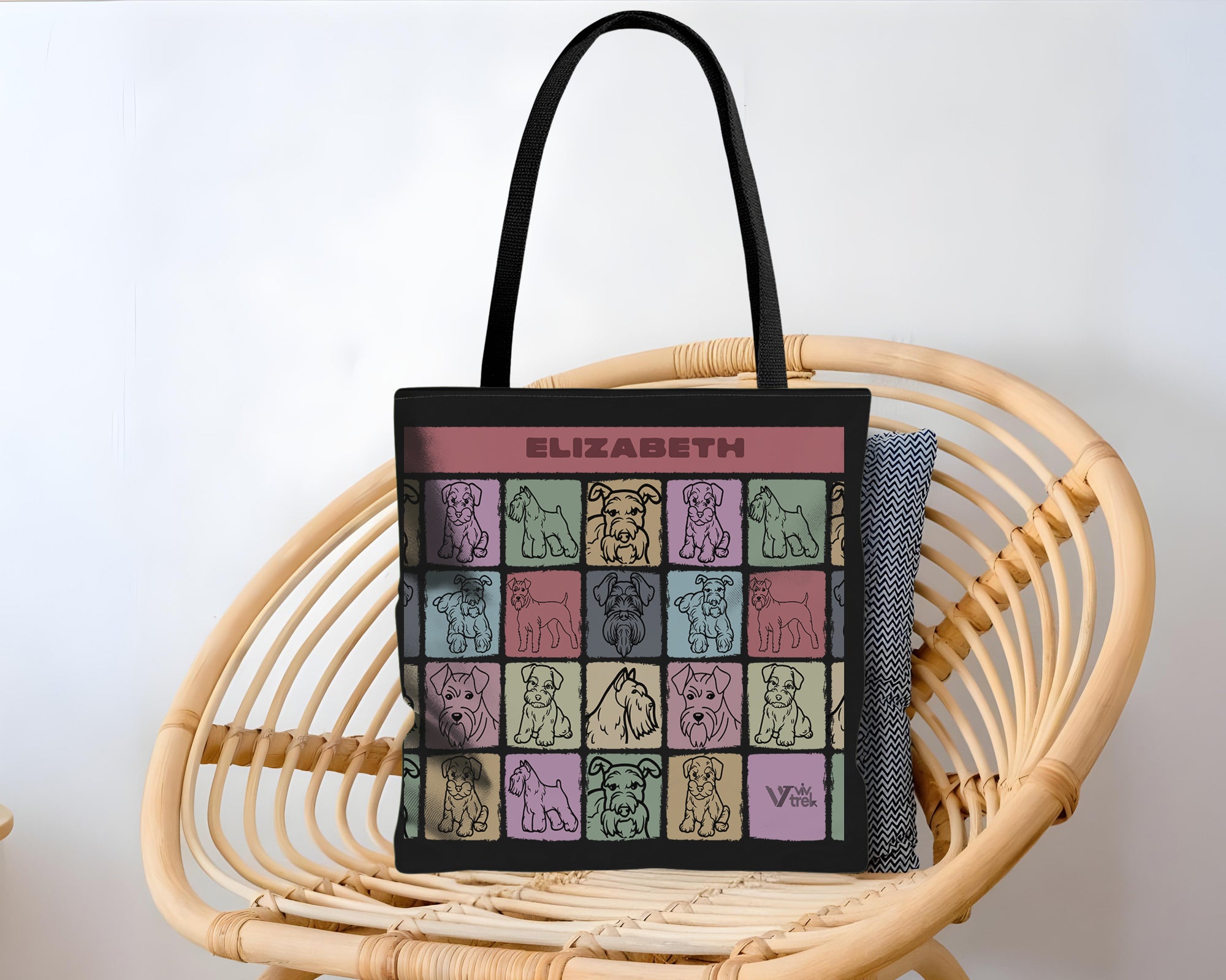 Tote bag with dog illustrations and branding with name text.
