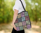 Tote bag with dogs pattern held by a person outdoors