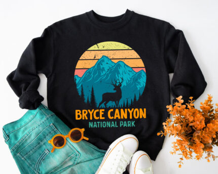 Vintage USA Parks Sweatshirt, Retro Mountain Adventure Sweatshirt, Outdoor Wildlife Silhouette Shirt, National Parks Sunrise Glow Top, USA Nature Enthusiast Apparel, Vintage Retro Wildlife Sweatshirt, Mountain Sunset Adventure Shirt, Animal Silhouettes National Park Sweatshirt, Sunburst Vintage Outdoor Shirt, Retro USA Parks Souvenir Sweatshirt